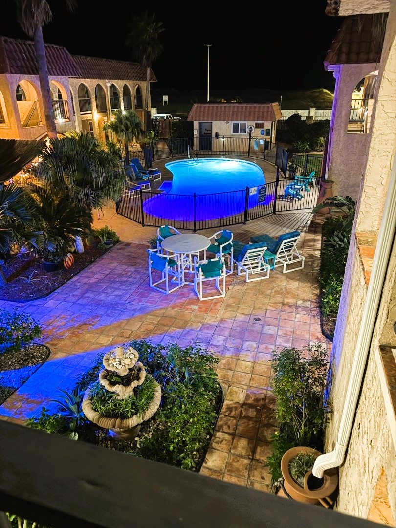 View of pool and courtyard in the evening.